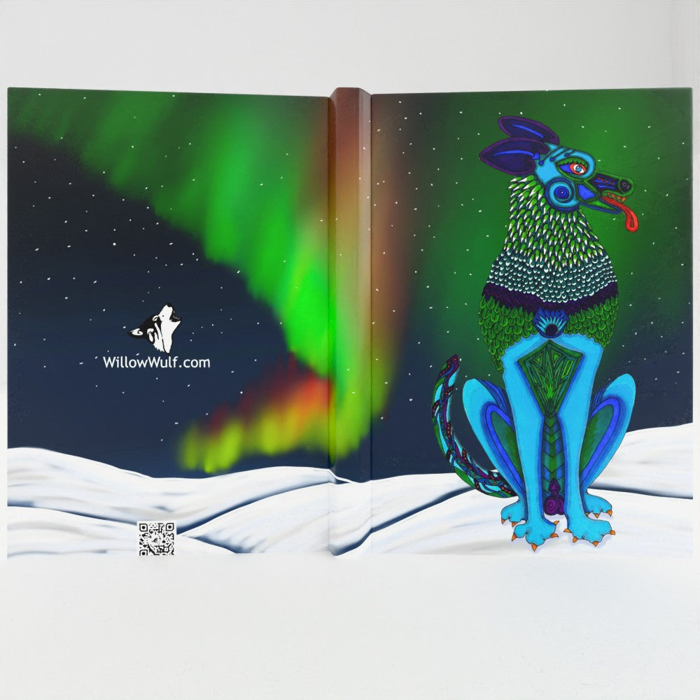 Wulfie A5 lined hardback notebook open spread showing northern lights artwork